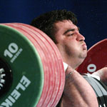 Hossein Reza Zadeh of Iran lifts 250 Kilograms in the Clean and Jerk and earns the Combined and Clean and Jerk Gold Medals during the Men's +105 KG Group A Final competition at the 2003 World Weightlifting Championships on November 22, 2003 at the Vancouver Convention and Exhibition Centre in Vancouver, British Colombia, Canada.  Robert Laberge / Getty Images 